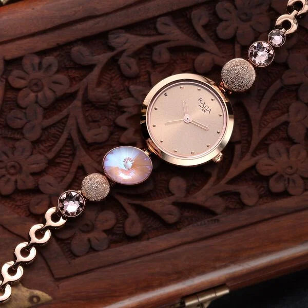 Titan 2606WM08 | Raga Women's Charm: Elegant Mother of Pearl Dial with Ornate Strap Watch