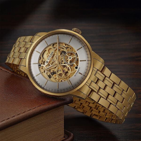 Titan 90110YM01 | Titan Golden Heart Skeletal Automatic Analog with Silver Dial Yellow Gold Stainless Steel Strap Watch for Men