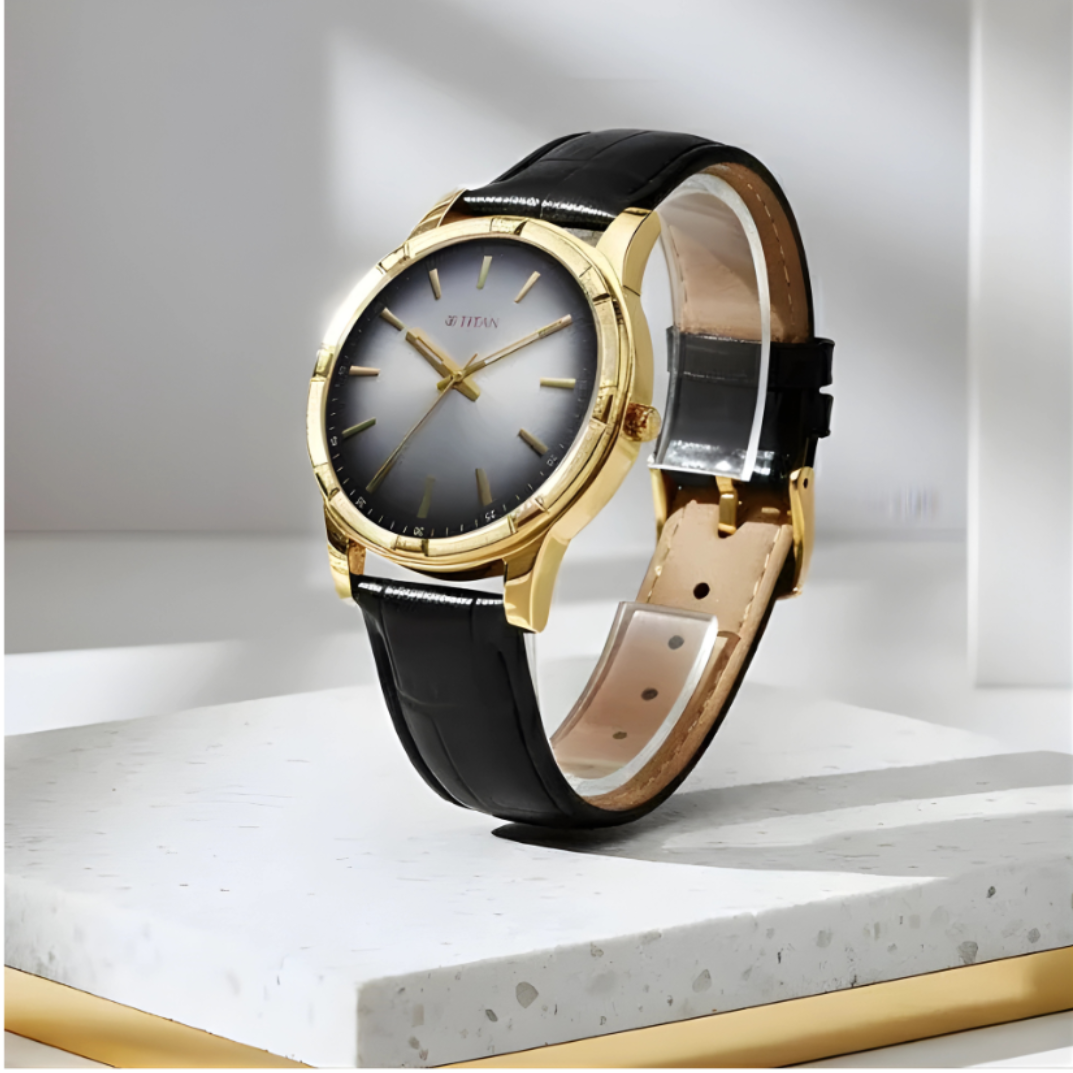 Luxury watch with black leather strap and gold casing on a white background
